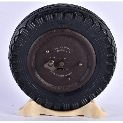 552 - AN UNUSUAL ART DECO SMITHS MOTORING INTEREST BAKELITE TYRE CLOCK. 17 cm x 12 cm.