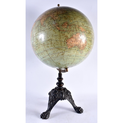 553 - A LARGE ANTIQUE W & A K JOHNSTONS 12 INCH TERRESTRIAL GLOBE upon a cast iron base. 54 cm x 24 cm.