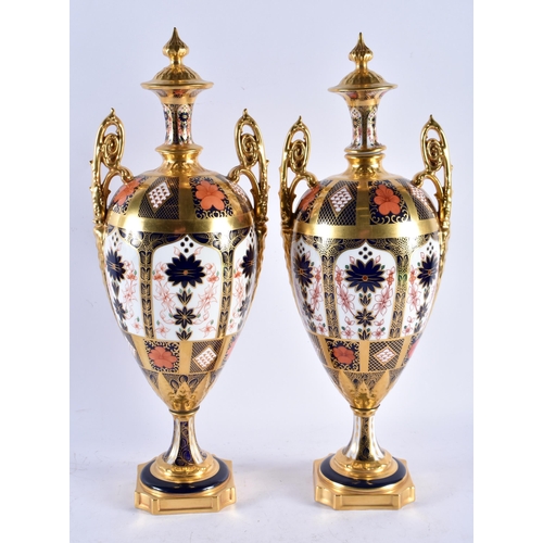 561 - A LOVELY LARGE PAIR OF ROYAL CROWN DERBY IMARI TWIN HANDLED PORCELAIN VASES. 42 cm x 14 cm.