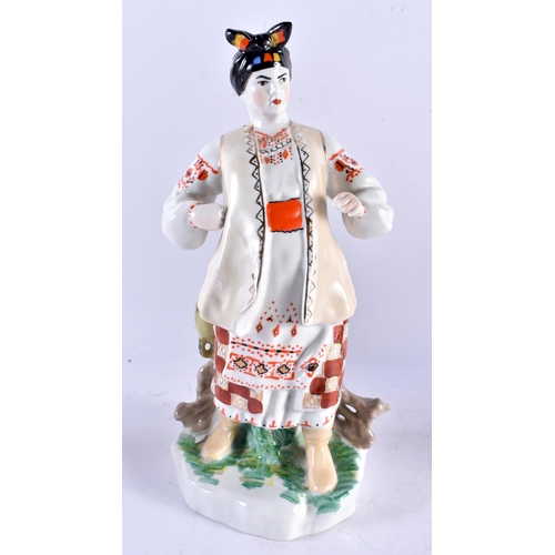 565 - A PAIR OF RUSSIAN UKRANIAN PORCELAIN FIGURES together with another. Largest 33 cm high. (3)