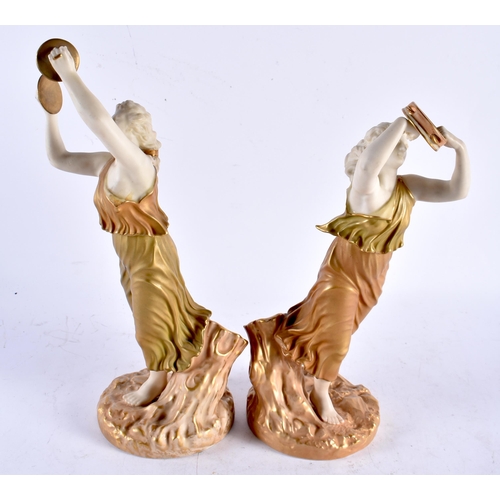 567 - A PAIR OF 19TH CENTURY ROYAL WORCESTER BLUSH IVORY PORCELAIN FIGURAL MUSICIANS. 25 cm high.