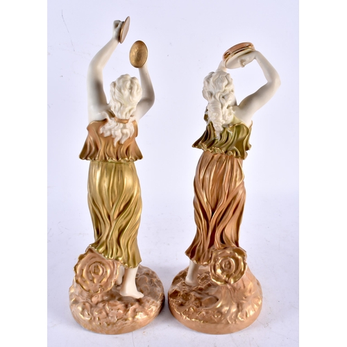 567 - A PAIR OF 19TH CENTURY ROYAL WORCESTER BLUSH IVORY PORCELAIN FIGURAL MUSICIANS. 25 cm high.