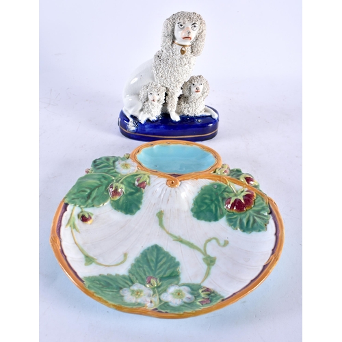 584 - A 19TH CENTURY STAFFORDSHIRE FIGURE OF THREE POODLES together with a Majolica dish in the manner of ... 