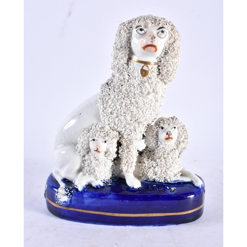 584 - A 19TH CENTURY STAFFORDSHIRE FIGURE OF THREE POODLES together with a Majolica dish in the manner of ... 