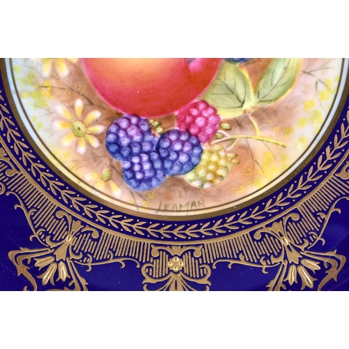 587 - A FINE ROYAL WORCESTER RAISED GILT PORCELAIN FRUIT PAINTED PLATE by Leaman. 26 cm diameter.