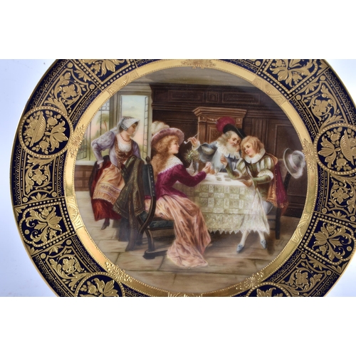 588 - AN ANTIQUE AUSTRIAN VIENNA PORCELAIN CABINET PLATE painted with figures within an interior. 23 cm di... 