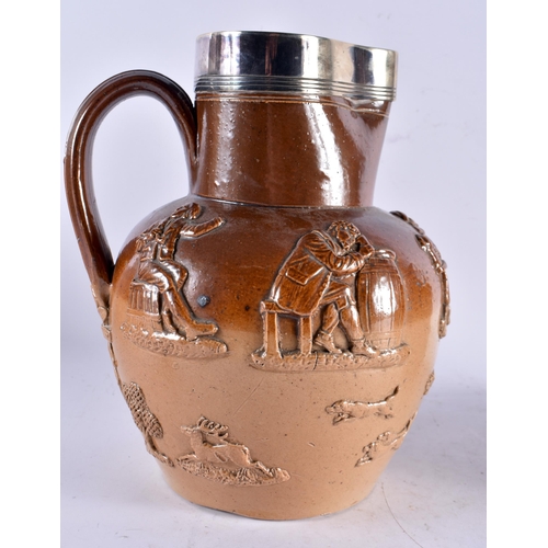 601 - TWO 19TH CENTURY ENGLISH STONEWARE JUGS one with probably silver mounts. Largest 24 cm x 15 cm. (2)