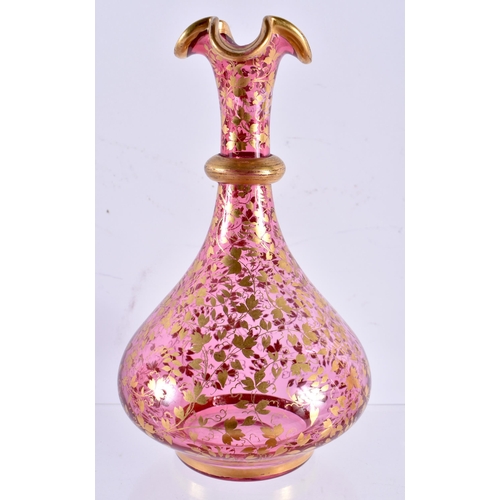 603 - A 19TH CENTURY BOHEMIAN RUBY GILDED GLASS LIQUOR DECANTER with tray and glasses. Largest 19 cm diame... 