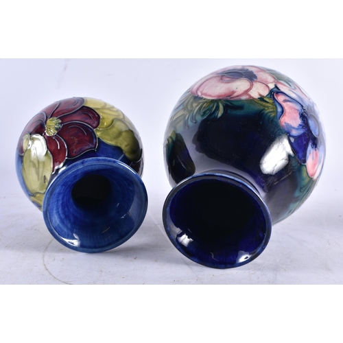 614 - TWO MOORCROFT VASES. Largest 18.5 cm high. (2)