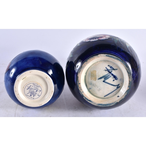 614 - TWO MOORCROFT VASES. Largest 18.5 cm high. (2)