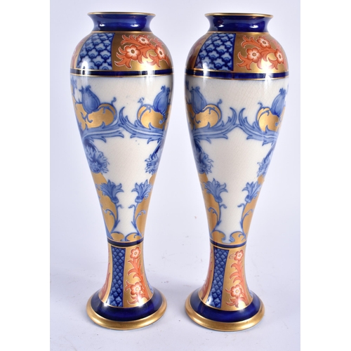 624 - A PAIR OF MOORCROFT MACINTYRE PORCELAIN BALUSTER VASES. 30 cm high.