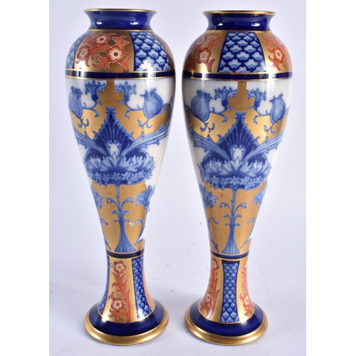 624 - A PAIR OF MOORCROFT MACINTYRE PORCELAIN BALUSTER VASES. 30 cm high.