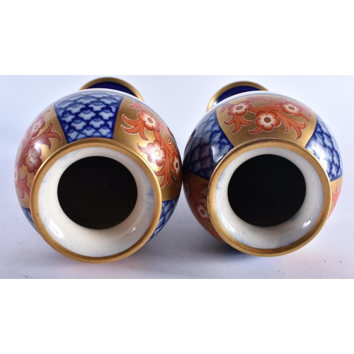 624 - A PAIR OF MOORCROFT MACINTYRE PORCELAIN BALUSTER VASES. 30 cm high.