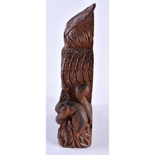 626 - A LARGE BLACK FOREST BAVARIAN OWL CLOCK together with a pair of antlers. Largest 34 cm x 18 cm. (2)