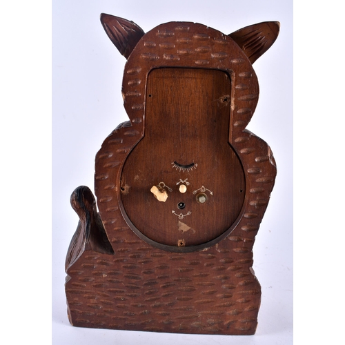 626 - A LARGE BLACK FOREST BAVARIAN OWL CLOCK together with a pair of antlers. Largest 34 cm x 18 cm. (2)