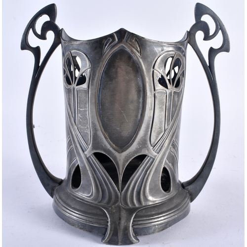 627 - AN ART NOUVEAU WMF PEWTER BOTTLE HOLDER. 21 cm x 18 cm.