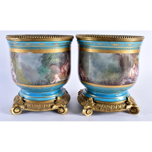 634 - A LARGE PAIR OF 19TH CENTURY FRENCH SEVRES PORCELAIN BRONZE PLANTERS painted with figures within lan... 