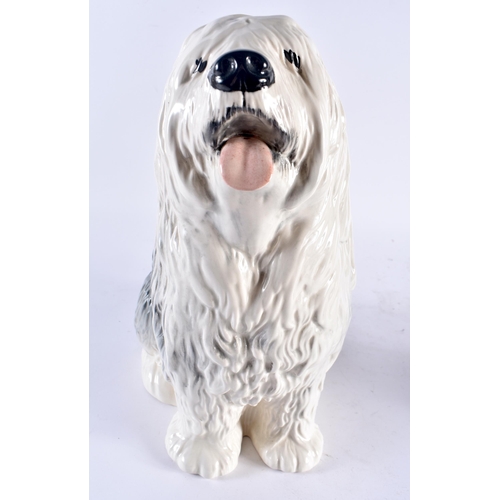 646 - AN ANTIQUE PARIANWARE FIGURE OF A FEMALE together with a Beswick sheep dog. Largest 37 cm high. (2)