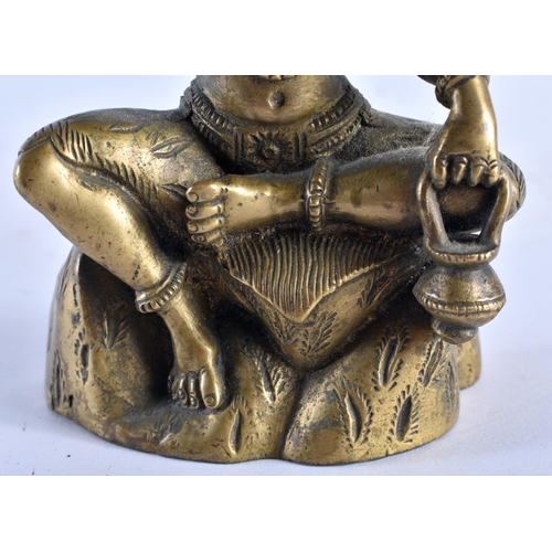 653 - A 19TH CENTURY MIDDLE EASTERN INDIAN BRONZE FIGURE OF A DEITY modelled with multiple arms. 16 cm x 8... 