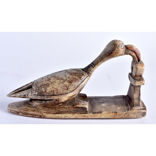 664 - AN ANCIENT EGYPTIAN SHABTI FIGURE together with a stone carving of a long necked bird. Largest 14 cm... 