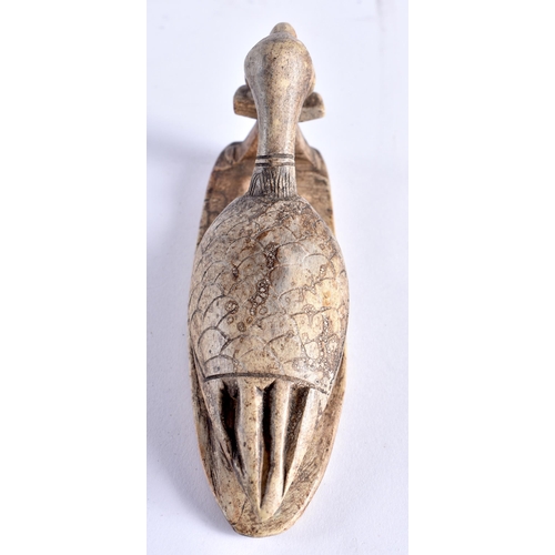 664 - AN ANCIENT EGYPTIAN SHABTI FIGURE together with a stone carving of a long necked bird. Largest 14 cm... 