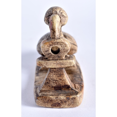 664 - AN ANCIENT EGYPTIAN SHABTI FIGURE together with a stone carving of a long necked bird. Largest 14 cm... 