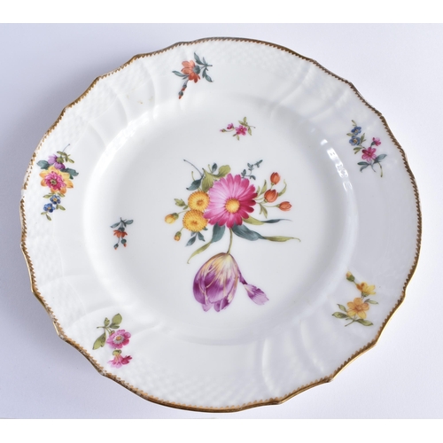 667 - A SET OF TEN DANISH ROYAL COPENHAGEN PORCELAIN SCALLOPED DISHES painted with flowers. 21 cm wide. (1... 