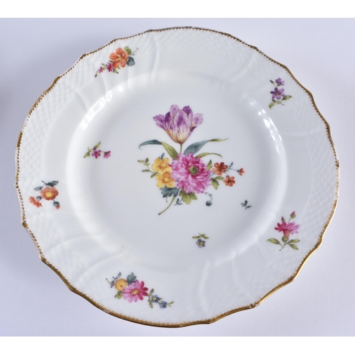 667 - A SET OF TEN DANISH ROYAL COPENHAGEN PORCELAIN SCALLOPED DISHES painted with flowers. 21 cm wide. (1... 