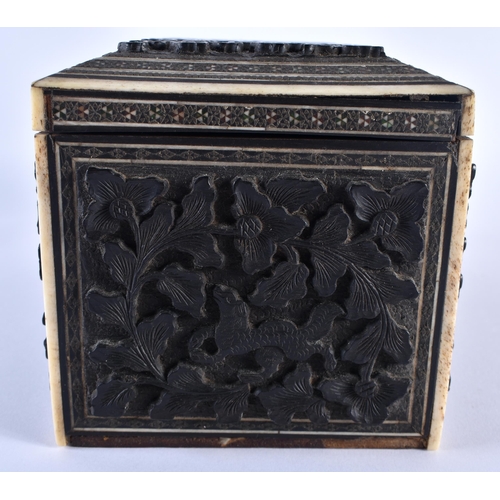 668 - A 19TH CENTURY MIDDLE EASTERN ANGLO INDIAN CARVED WOOD CASKET decorated with buildings and foliage. ... 