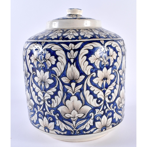 669 - A LARGE MIDDLE EASTERN FAIENCE TIN GLAZED IZNIK STYLE JAR AND COVER together with a tin glazed faien... 