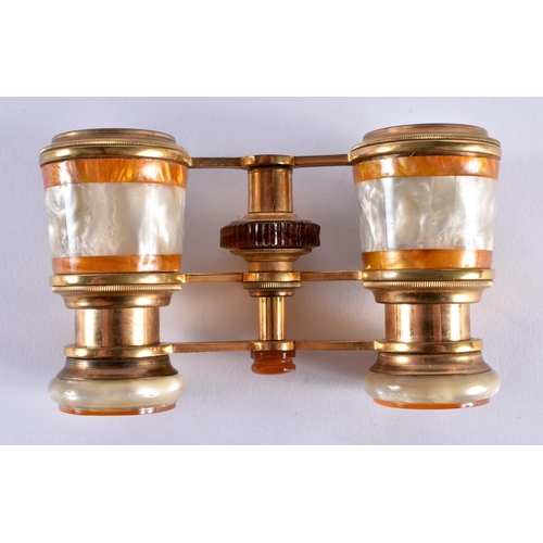 674 - A PAIR OF MOTHER OF PEARL OPERA GLASSES. 8 cm x 5.5 cm extended.