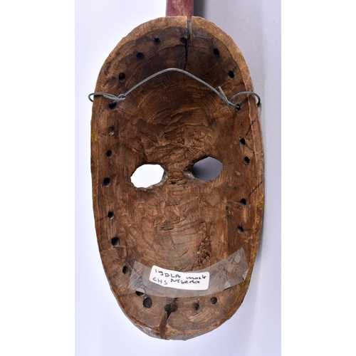 697 - AN AFRICAN PAINTED WOOD TRIBAL NIGERIAN IGALA MASK. 36 cm x 8 cm.