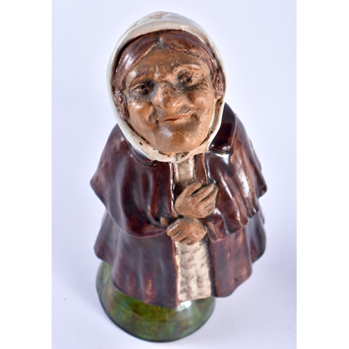 707 - A RARE PAIR OF ANTIQUE PORTUGUESE NODDING HEAD POTTERY FIGURES modelled as peasants. 22 cm high.