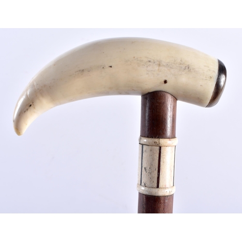 708 - AN ANTIQUE WHALEBONE MARITIME WALKING CANE. 80 cm long.