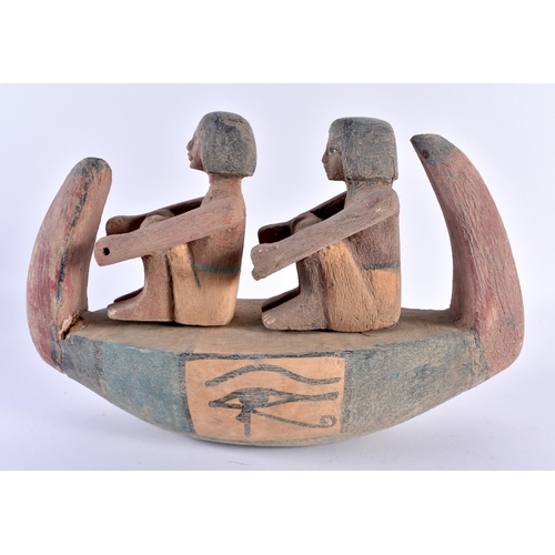 713 - AN ANICENT EGYPTIAN CARVED WOOD FUNERARY BOAT C664-332 BC. 27 cm x 18 cm.