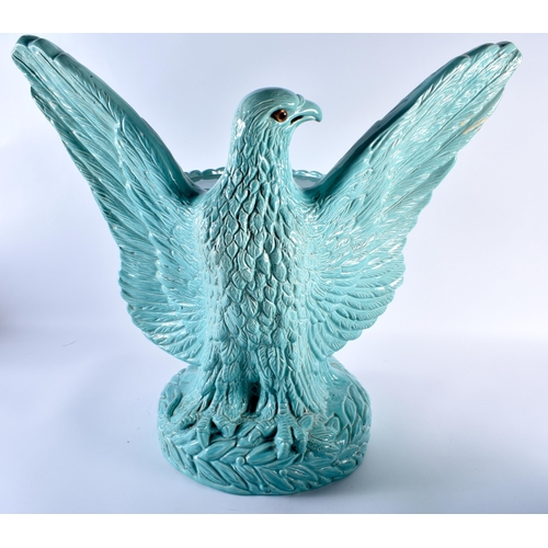 715 - A RARE ANTIQUE CONTINENTAL BLUE GLAZED MAJOLICA EAGLE PEDESTAL PLANTER ON STAND. 58 cm x 52 cm.