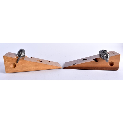 726 - A PAIR OF DAVID LINLEY CARVED WOOD CHEESE BLOCK DOOR STOPS. 17 cm x 6 cm.