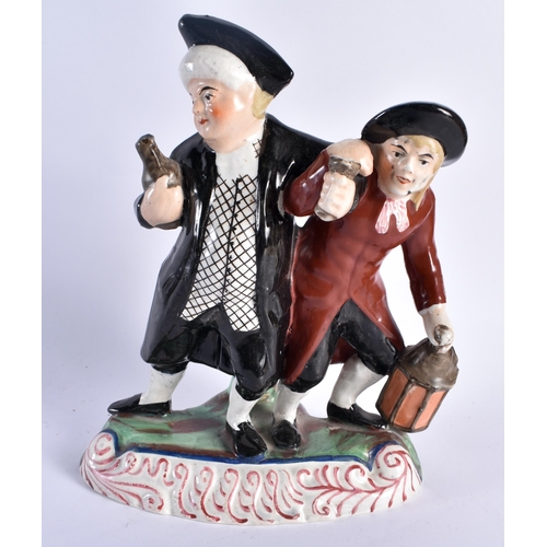 731 - A 19TH CENTURY STAFFORDSHIRE POTTERY FIGURE OF TWO DRUNKEN MALES together with a Staffordshire spani... 