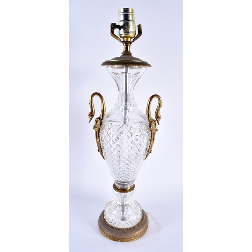 758 - A LARGE CUT GLASS TWIN HANDLED SWAN NECK COUNTRY HOUSE LAMP. 50 cm high.