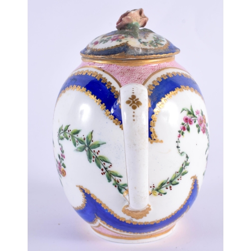 76 - AN 18TH CENTURY SEVRES PORCELAIN TEAPOT AND COVER painted with floral sprays. 12 cm wide.