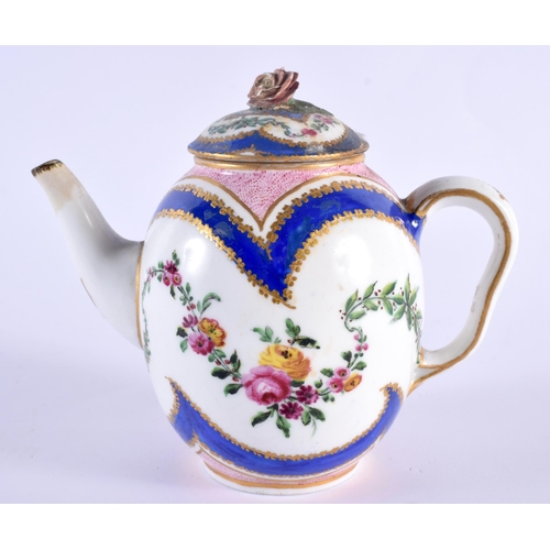 76 - AN 18TH CENTURY SEVRES PORCELAIN TEAPOT AND COVER painted with floral sprays. 12 cm wide.