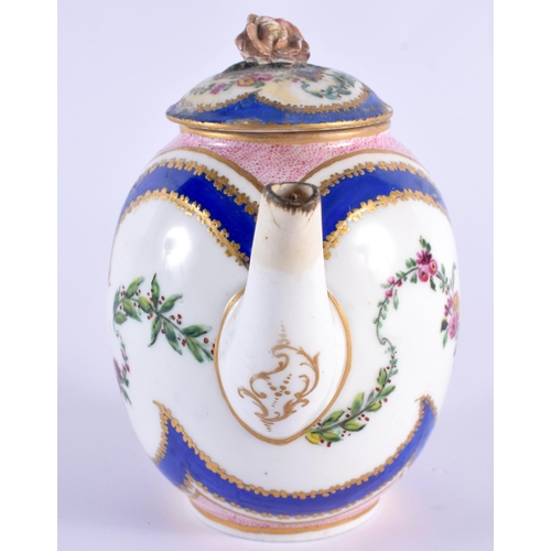 76 - AN 18TH CENTURY SEVRES PORCELAIN TEAPOT AND COVER painted with floral sprays. 12 cm wide.