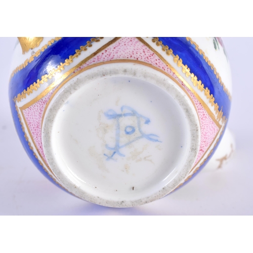 76 - AN 18TH CENTURY SEVRES PORCELAIN TEAPOT AND COVER painted with floral sprays. 12 cm wide.