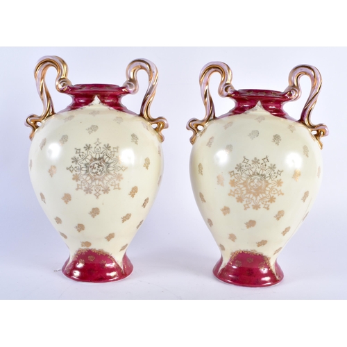 767 - A PAIR OF AUSTRIAN VIENNA STYLE TWIN HANDLED VASES. 20 cm x 10 cm.