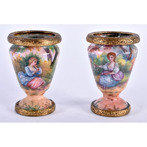 768 - A PAIR OF EARLY 20TH CENTURY FRENCH ENAMELLED VASES painted with landscapes. 6 cm x 4 cm.