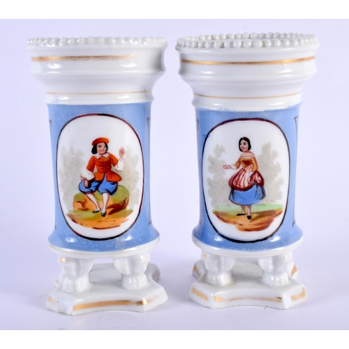 77 - A PAIR OF 19TH CENTURY FRENCH PORCELAIN SPILL VASES painted with figures. 14 cm high.