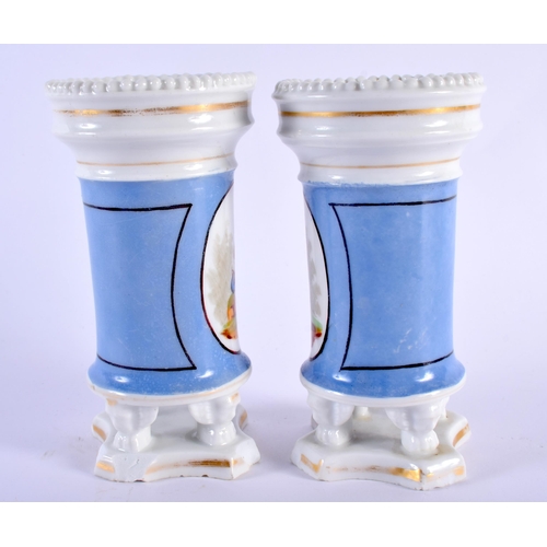 77 - A PAIR OF 19TH CENTURY FRENCH PORCELAIN SPILL VASES painted with figures. 14 cm high.