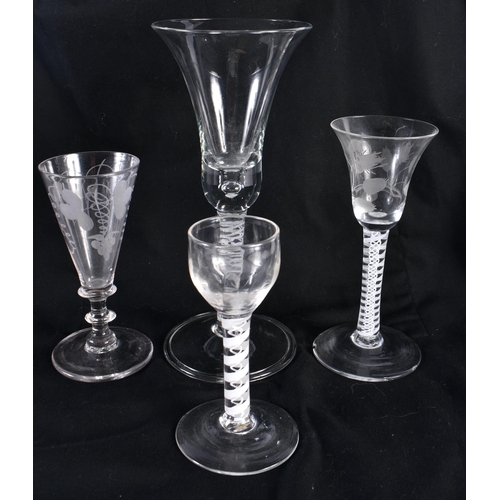 770 - FOUR ANIQUE WINE GLASSES three with spiral twists. Largest 22.5 cm high. (4)