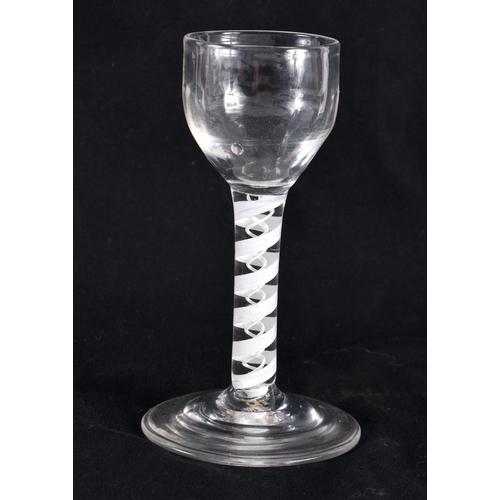 770 - FOUR ANIQUE WINE GLASSES three with spiral twists. Largest 22.5 cm high. (4)