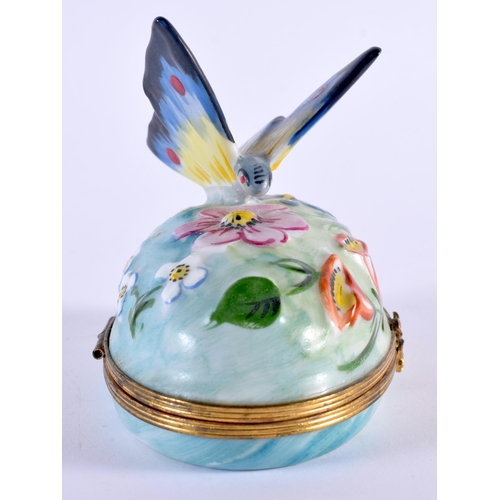 81 - A FRENCH LIMOGES PORCELAIN BUTTERFLY PILL BOX AND COVER. 9.5 cm x 8.5 cm.